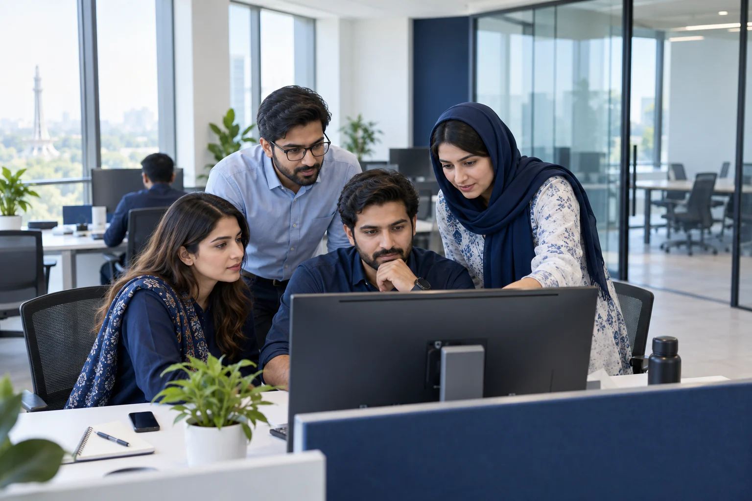 Pakistani software engineering team collaborating in a Lahore innovation center